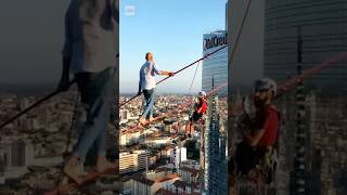 Man performs Italy’s highest city tightrope walk