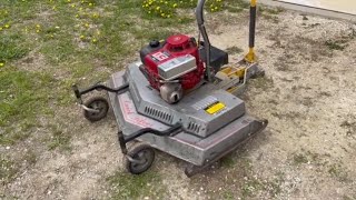 Quick Silver finish mower mounted on the front of an ATV | Belted Galloway Homestead