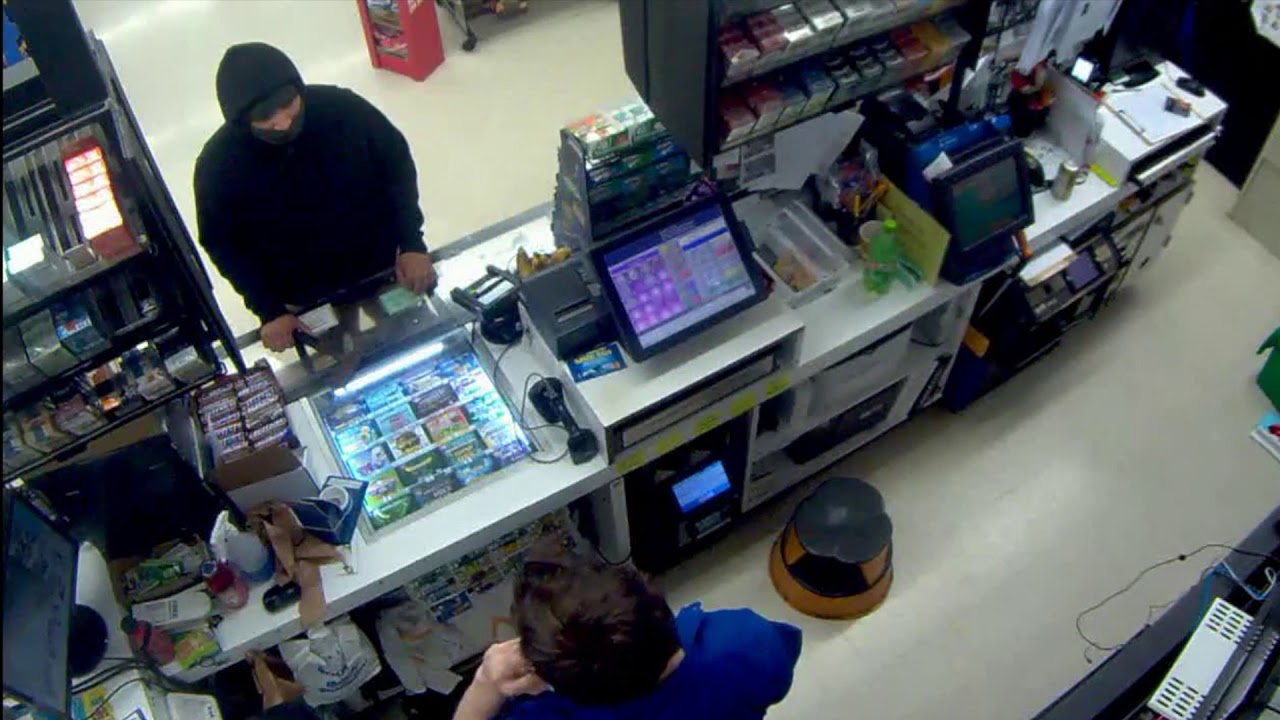 Robber pulls hatchet; clerk pulls handgun; we seek tips