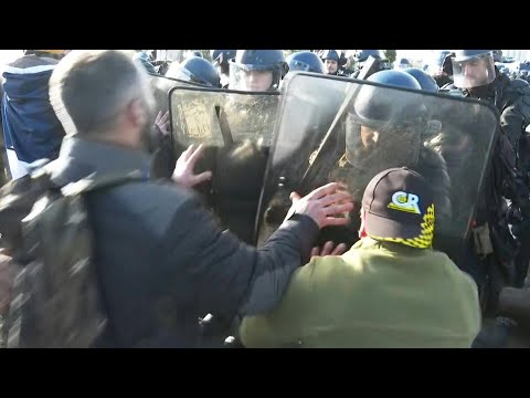 Video Thumbnail: Tensions flare as police confront French farmers at blocked depot | AFP