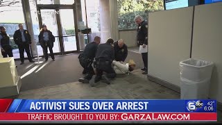 Knoxville activist sues over arrest