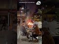 French diners sit with wine despite raging protest fire