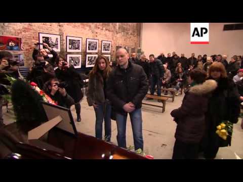 Fistfight breaks out after funeral of opposition activist