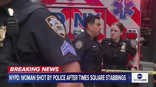 Woman shot by police after stabbing two people in Times Square