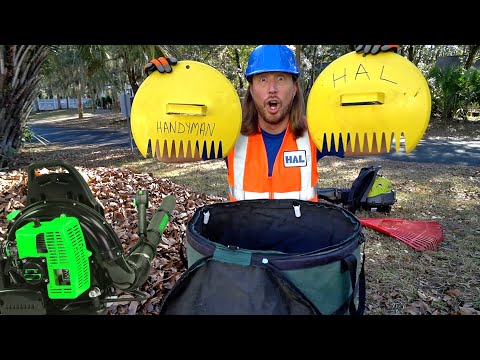 Man in a blue hard hat and orange safety vest holds two large yellow circular props labeled 'HANDYMAN' and 'HAL' outdoors, with yard tools and piles of leaves around.