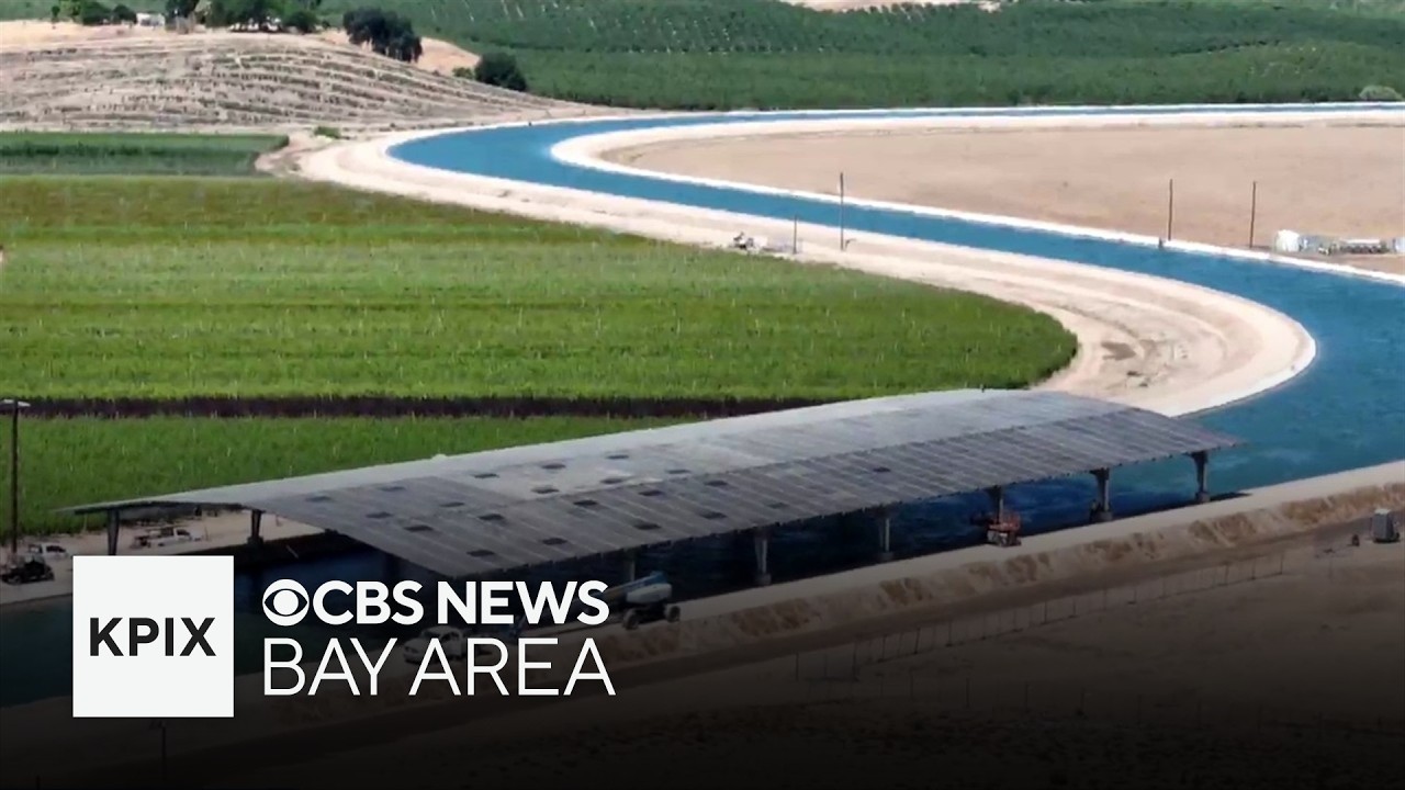 Solar panels mounted above an irrigation canal in California's Central Valley