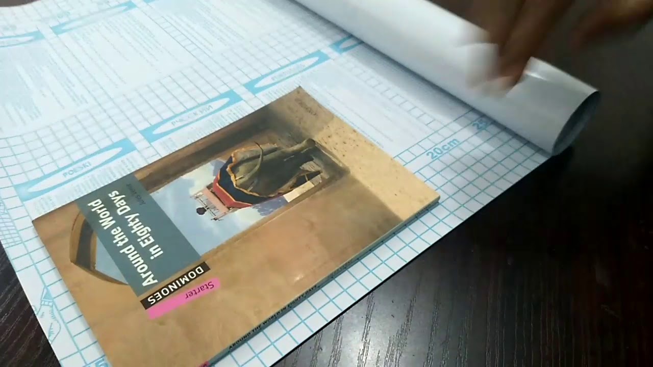 Wrapping book using self adhesive sheet.