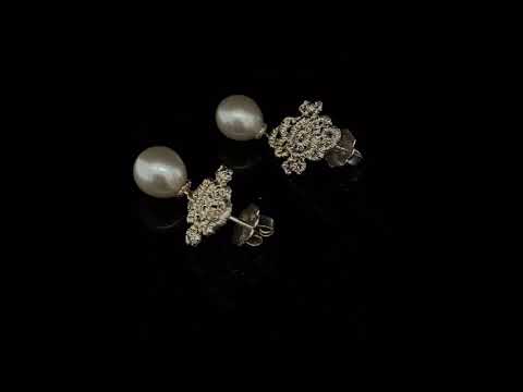 romantic lace-like pearl and silver Mona Lisa stud earrings by Brigitte Adolph