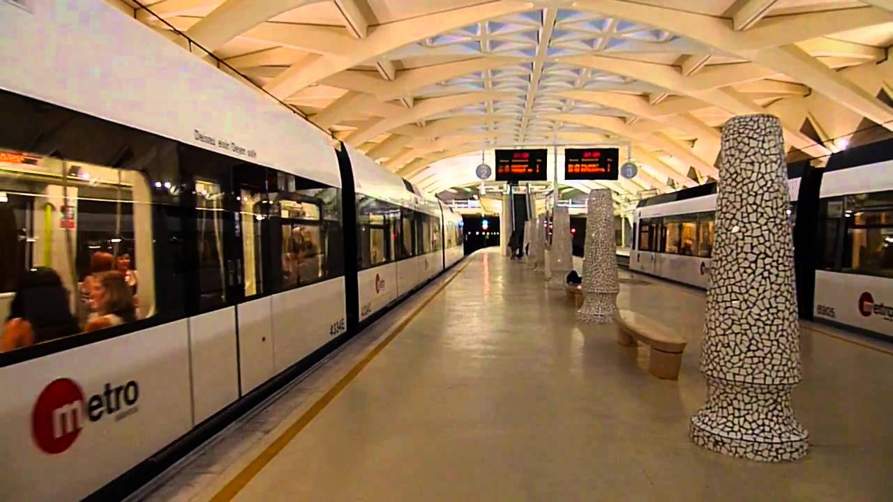 Valencia metro train departing from Alameda station