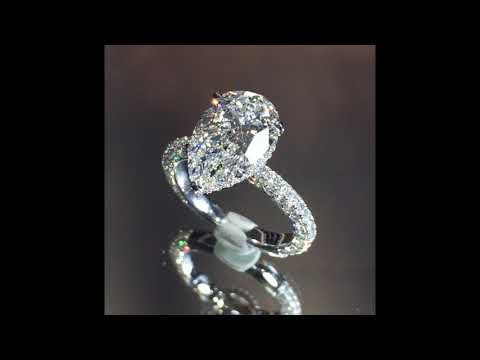 3.26 ct Pear Shape Diamond Three-Row Ring