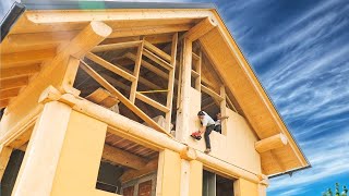 Building The Walls Of The Log Post And Beam House