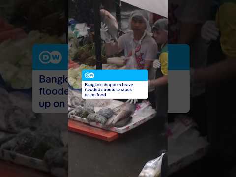 Bangkok shoppers brave flooded streets to stock up on food | DW News