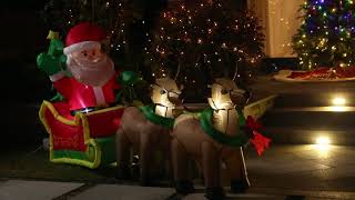 Glitzhome NorthLight 4 ft. Inflatable Santa Sleigh & Reindeer Lighted Christmas Yard Decor
