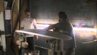 Barretti hand shaping a surfboard
