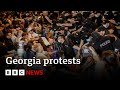 Georgia: Protesters hit by police water cannons after passing of 'Russian inspired' bill | BBC News