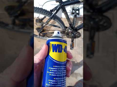 Spraying the Bicycle Chain and the Gears with WD-40