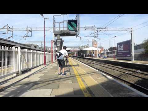 Class 68 013 with tone and Class 390 at Harrow and Wealdstone.