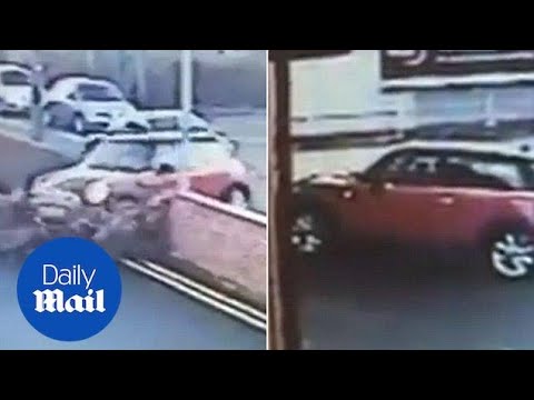 Bizarre collision as Mini driver U-turns through brick wall - Daily Mail