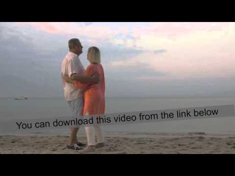 Senior couple dancing on the beach