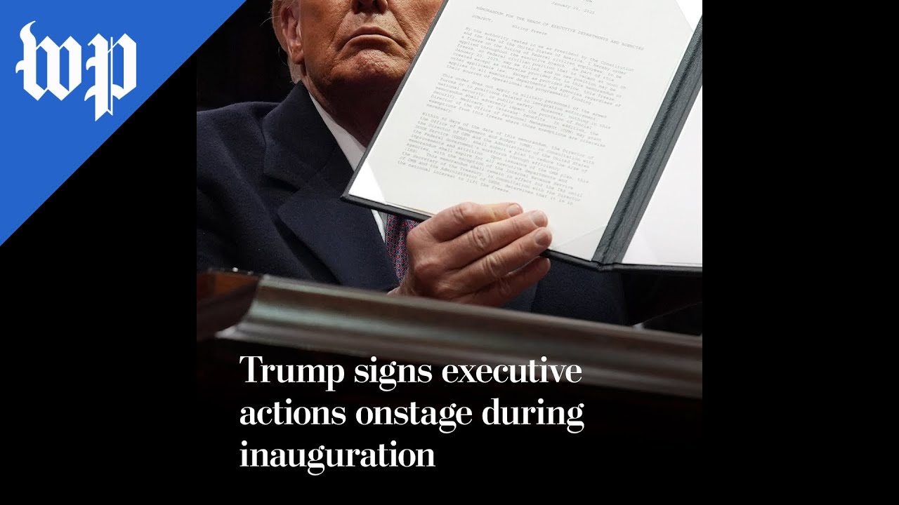 Trump signs executive actions onstage during inauguration
