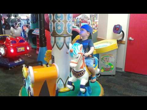Micah on the Merry Go 'Round at Chuck E. Cheese's