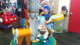 Micah on the Merry Go 'Round at Chuck E. Cheese's