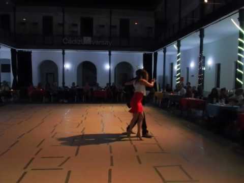  German Salvatierra  and  Mariana Patsarika  are  dancing  to  "  Milonga Del Ochenta Y Tres  "  by  Juan D'Arienzo  at  International Tango Festival in Cadiz  in  2016