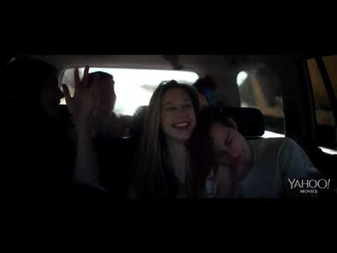 Trailer shot of a night drive through Austin with bokeh lights, mirroring the soundtrack’s glow