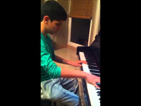Iranian young boy plays on piano 