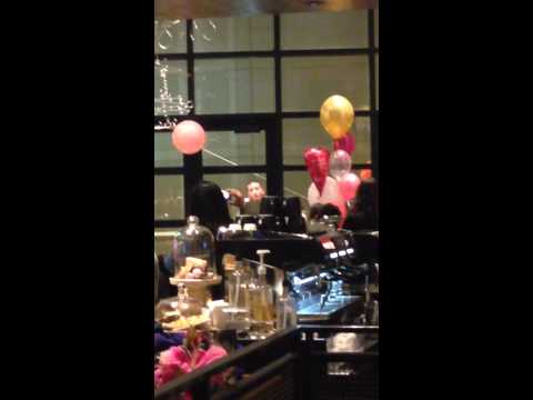 Carlito Olivero singing at Starbucks