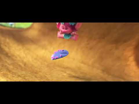 Trolls 2016 official trailer frame with Poppy and Branch dancing in a glittery forest