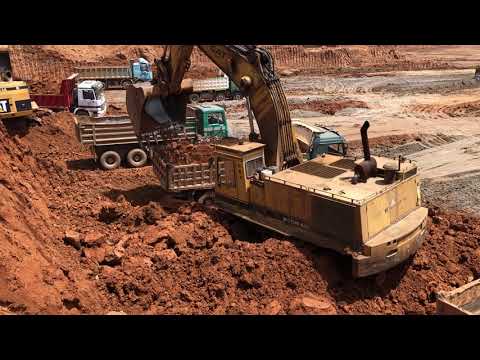 Caterpillar 245 Excavator Loading Mercedes And MAN Trucks