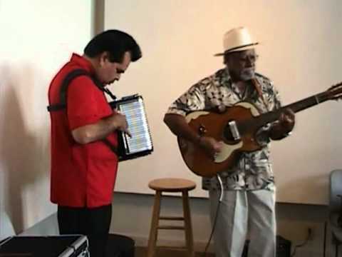 Andy Cardenas and Rudy Lopez performing Las Gaviotas at the Carver Community Center