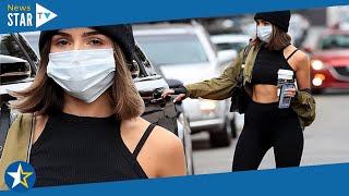 Olivia Culpo shows off her incredibly toned abs in a crop top as she picks up a post-workout coffee
