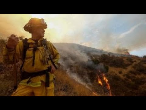 Crews fight to contain massive wildfires in Calif., Oregon