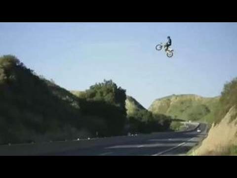 Dirt bike jumps over the freeway