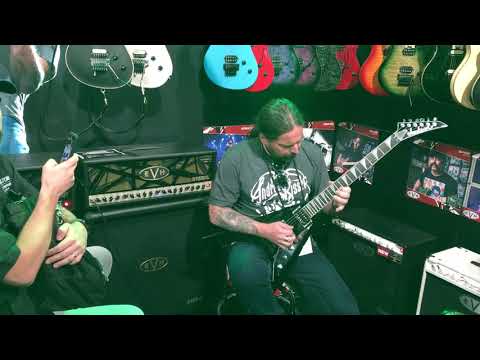 Andreas Kisser from Sepultura testing  a Jackson guitar at NAMM.
