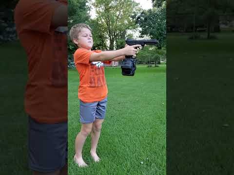Kid shooting airsoft gun