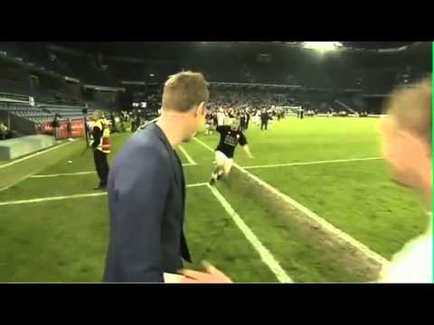 Danish TV's Peter Møller taken out by Lars Jacobsen's slide tackle after Copenhagen won the league