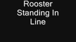 Rooster Standing in Line