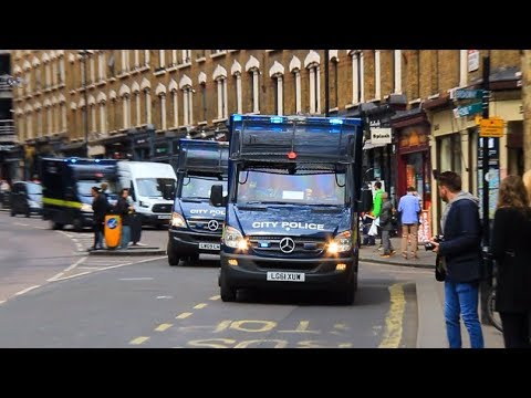 x4 City of London Police vans responding in convoy