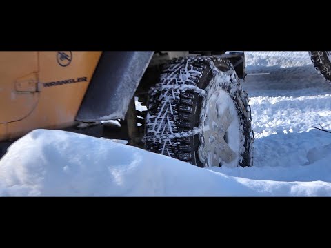 Tire chains vs no chains comparison, Jeep rubicon, steep snow covered hill.