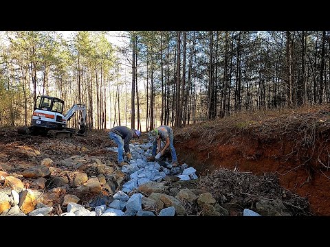 Installing Rip Rap for Drainage Ditch and Erosion Control