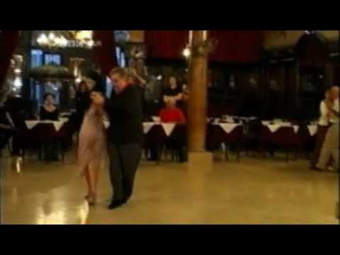  Puppy Castello  and  Geraldine Rojas  are  dancing  to  a  tango