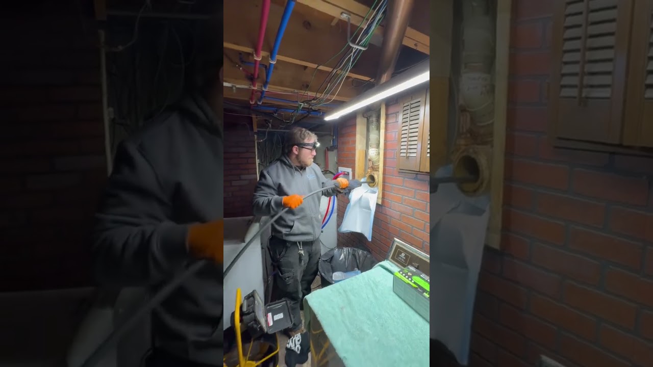 Velocity Master Plumbing technician performing professional drain cleaning service in Ann Arbor Michigan