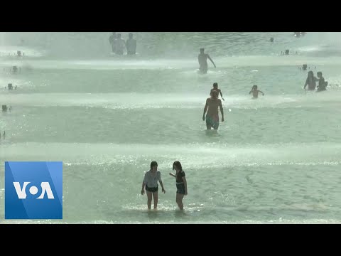 Parisians Swim in Fountains as Temperatures Soar in Europe