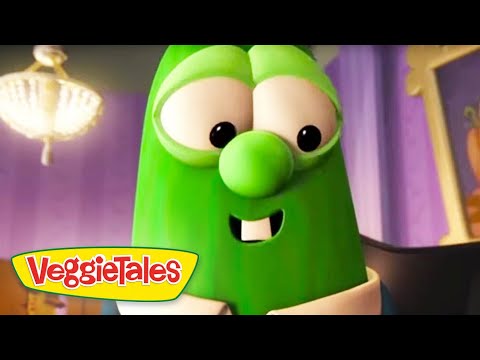 Larry the Cucumber from VeggieTales smiles at the camera, with the VeggieTales logo visible in the bottom-left corner.