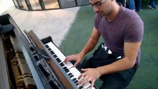 Street musician Ranny Deep improvised  play on piano.
