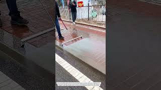 This Satisfying Water Broom Makes Sidewalk Cleaning So Easy