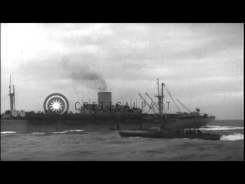 LCIs and AK (cargo ship) underway head for a beach during the D-Day invasion of N...HD Stock Footage